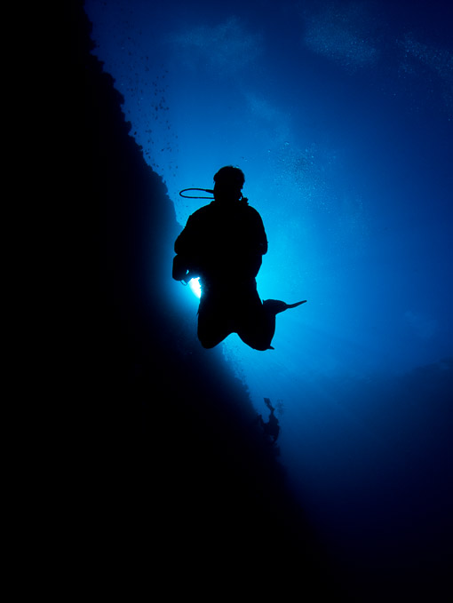 Diver in Silhouette - Siladen Wall